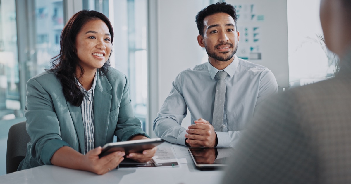 Business professionals reviewing analytics data during a B2B website tracking meeting