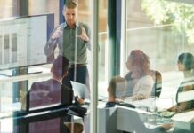 How to Make Business Central Your System of Record Without Slowing Everything Down Business leader presenting company data and reporting to a management team