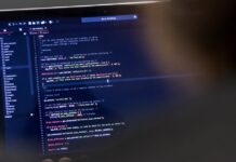 Custom WordPress Plugin vs SaaS, A Practical Decision Checklist Laptop displaying WordPress code for a custom plugin versus SaaS decision