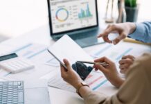 GA4 for B2B Websites, How to Read the Numbers (Without Becoming an Analyst) Business team reviewing analytics dashboards and performance reports