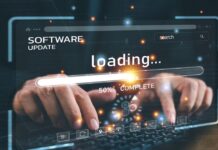 Lighthouse & PageSpeed Insights Scores: What They Really Mean (and When “Good Enough” Actually Is) Developer monitoring a website software update and loading performance on a laptop