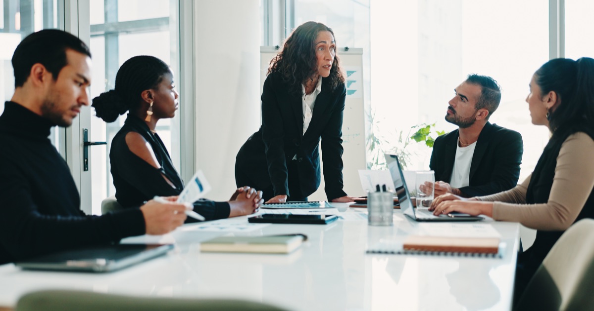 Finance team discussing accounting reports during a software migration